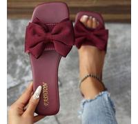 Damen Flat Sandalen mit Schleifenverzierung, modischer Lässig-Stil, rutschfest, geeignet für Sommer Strandpartys, Zehentrenner, erhältlich in Schwarz,