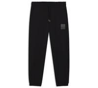 HUGO Jogginghose aus Baumwoll-Terry mit Split-Logo - Style Dusplitan, 50542866 Schwarz XS