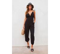 Schwarzer V-Ausschnitt Knoten-Schulter Rückenfreier Jumpsuit mit Taschen M