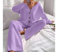 Strickjacke mit überschnittener Schulterpartie und Strickhose mit Schnürung vorne