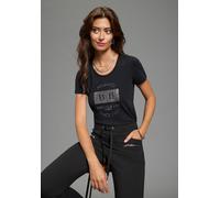 T-Shirt BRUNO BANANI, Damen, Gr. 32/34, schwarz, Single Jersey, Obermaterial: 95% Baumwolle, 5% Elasthan, bedruckt, Basic hüftlang, Rundhals, Shirts T-Shirt, mit schimmerndem Glitzerprint und Basic-Pa
