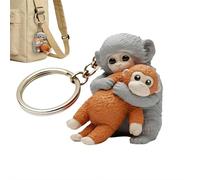 Yiokii Protect Punch The Monkey Schlüsselanhänger, niedlicher 3D-Affe, der Plüschtier hält, Schlüsselanhänger, Dekoration, Geschenk für Rucksack, Geldbörse, Schlüssel, Auto
